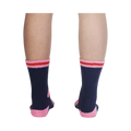 Back view of the socks on a person's legs, highlighting the design details from the back.