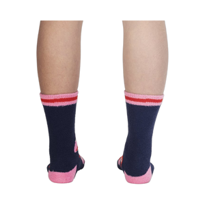 Back view of the socks on a person's legs, highlighting the design details from the back.