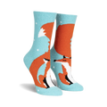 Fuzzy crew socks in teal and orange, featuring a cute fox design with small white dots. 