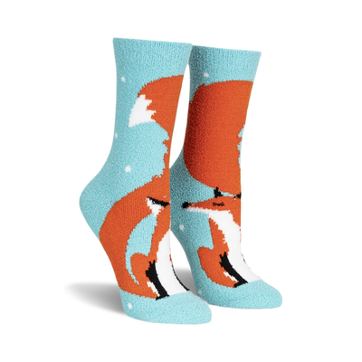 front view of a pair of fuzzy blue socks with an orange fox design.