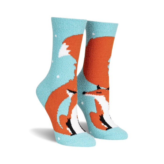 front view of a pair of fuzzy blue socks with an orange fox design.