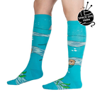 Lifestyle shot of model wearing 'Plays Well With Otters' knee-high socks, showcasing the fun, whimsical design.