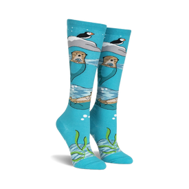 knee high blue novelty sock with otter, pufin, and seaweed pattern. cute and cozy for movie marathons or an ocean getaway.   