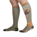 Lifestyle shot of a person wearing the 'Hang in There' sloth socks.