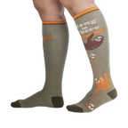 Lifestyle shot of a person wearing the 'Hang in There' sloth socks.