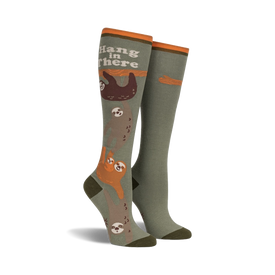 green and brown sloth knee high socks for women with "hang in there" text on the cuff.   