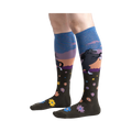 Lifestyle shot: Model wearing a pair of 'Black Beauty' knee-high socks, showing the design and fit.