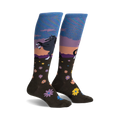 Pair of women's knee-high socks.  Olive green with a sunset scene, a dark horse, and scattered flowers. Blue and purple iridescent top cuff.