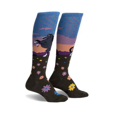 dark brown floral pattern knee-high socks for women feature a leaping black horse against a sunset background. horse-themed socks.  