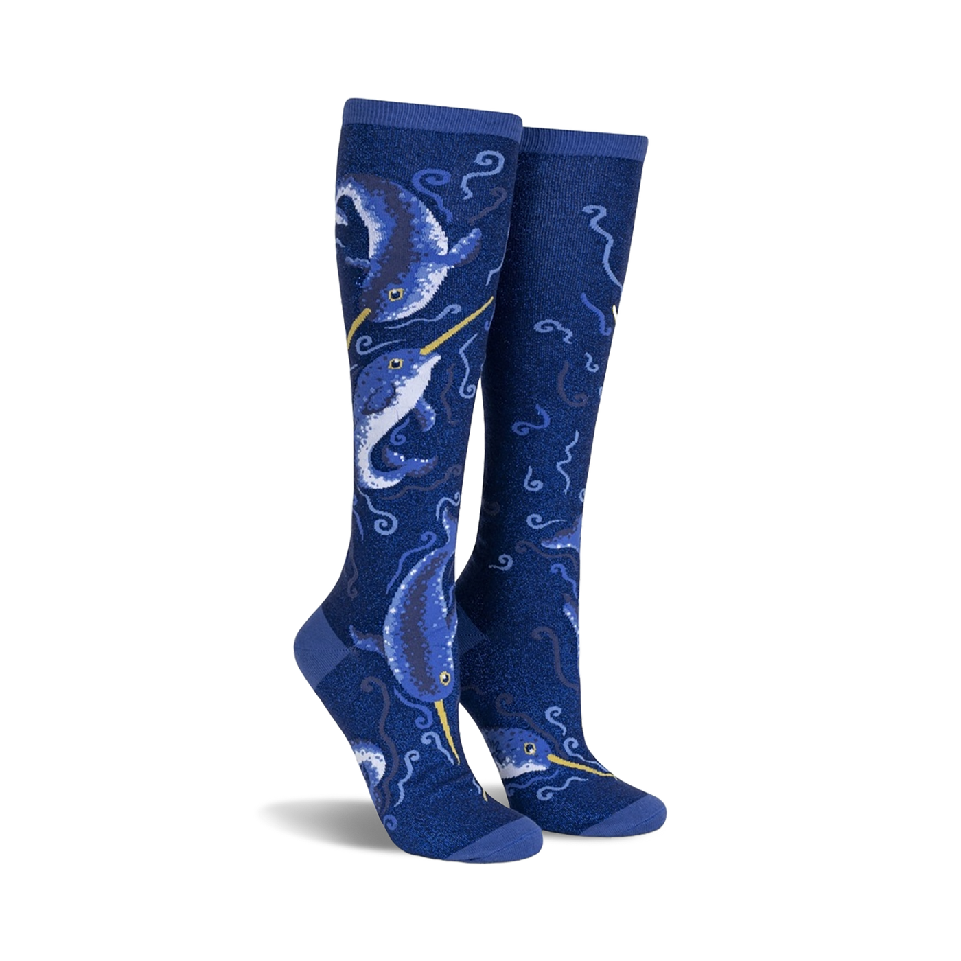 Pair of knee-high socks in navy blue.  Features a whimsical design of narwhals and swirling ocean patterns with subtle shimmer.