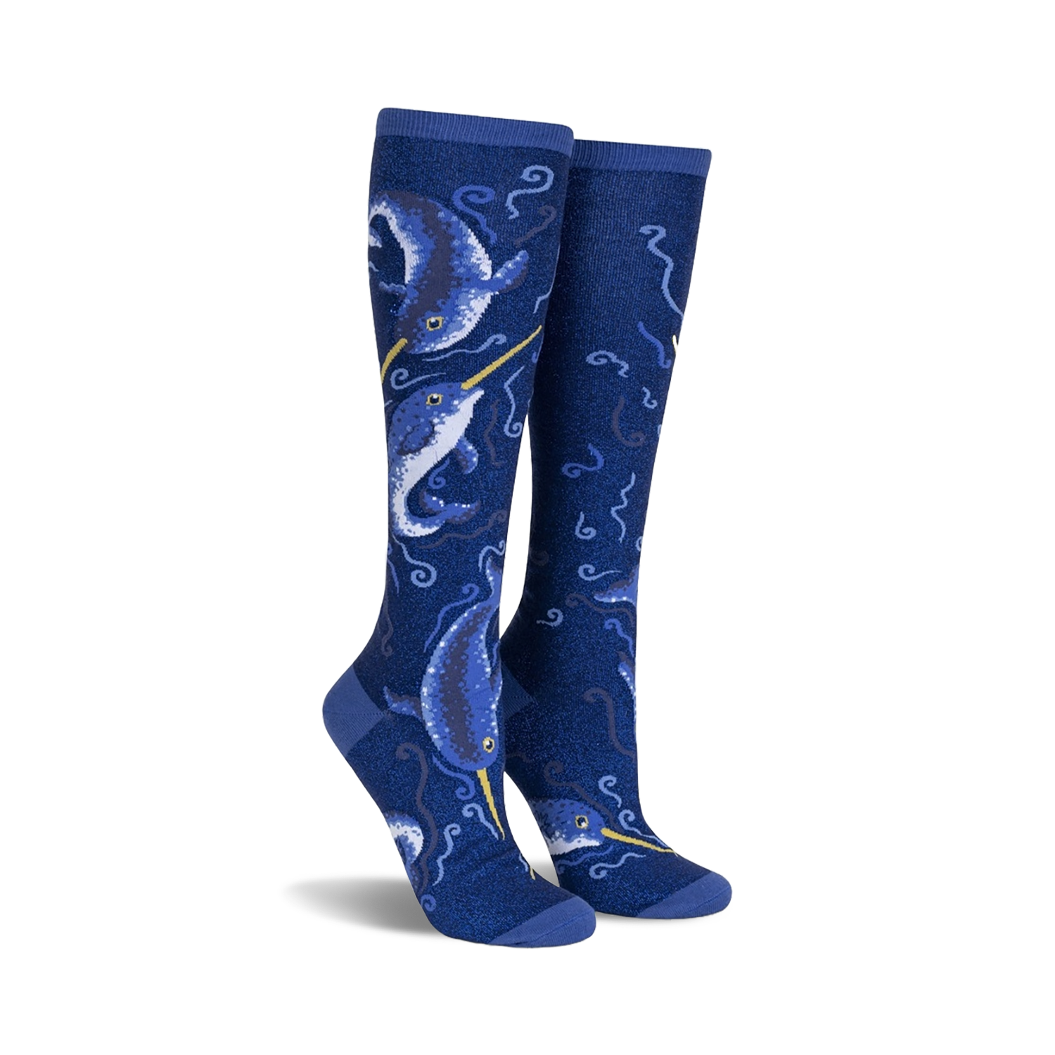 Pair of knee-high socks in navy blue.  Features a whimsical design of narwhals and swirling ocean patterns with subtle shimmer.