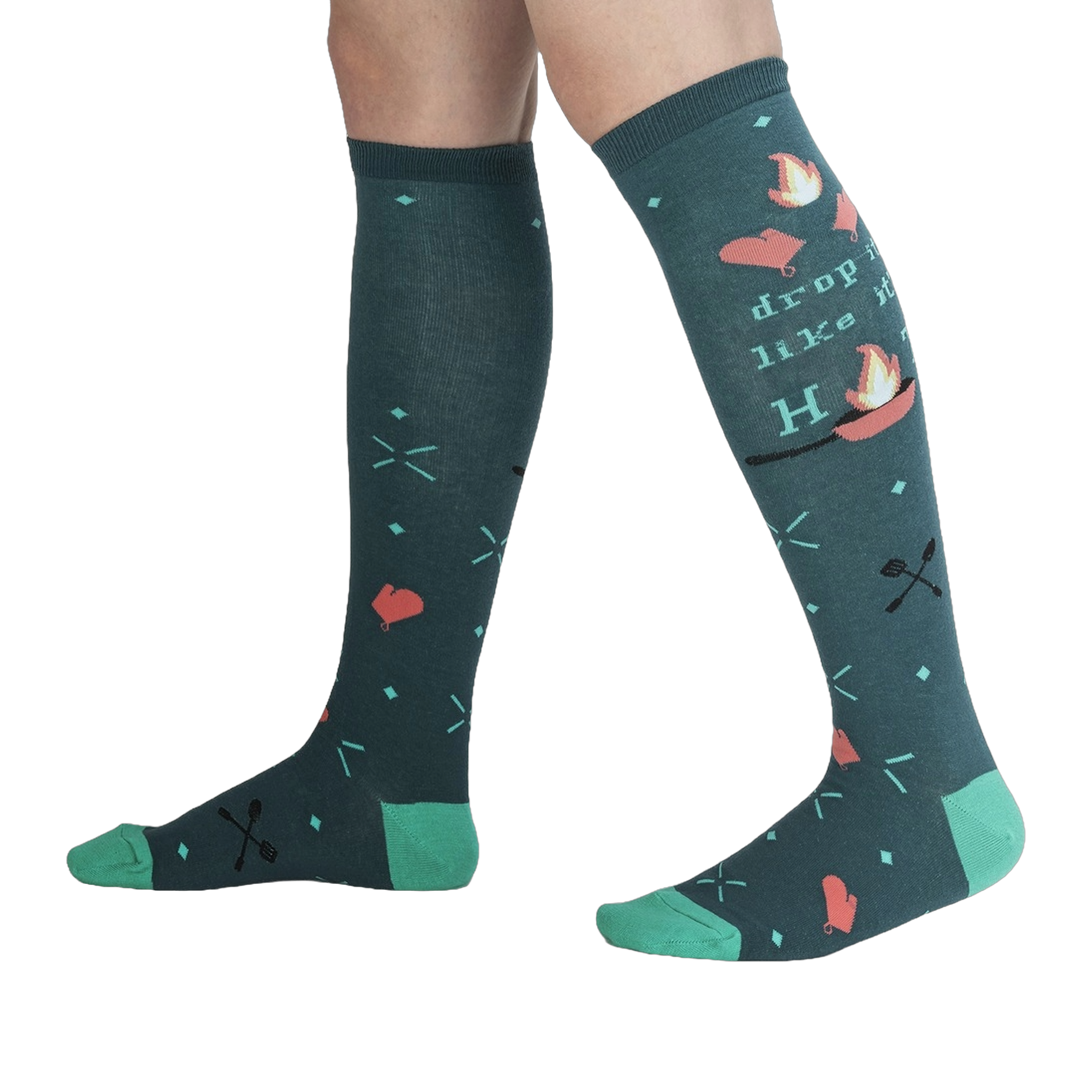 Lifestyle shot showing the 'Drop It Like It's Hot' socks on a person's legs.  The teal and green colors pop against the dark background.