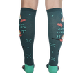 Back view of the 'Drop It Like It's Hot' socks showing the full design on both socks. The teal color and whimsical graphics are clearly visible.