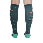 Back view of the 'Drop It Like It's Hot' socks showing the full design on both socks. The teal color and whimsical graphics are clearly visible.