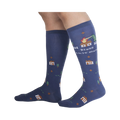 Lifestyle shot of 'Bless This Mess' socks on a person's legs, showcasing the sock's length and design.