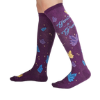 Lifestyle shot showcasing the 'You're a Gem' knee-high socks on a person's legs, showing off the design and fit.