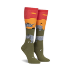 Pair of knee-high socks in olive green, orange, and red.  Design features rhinos against a sunset backdrop.