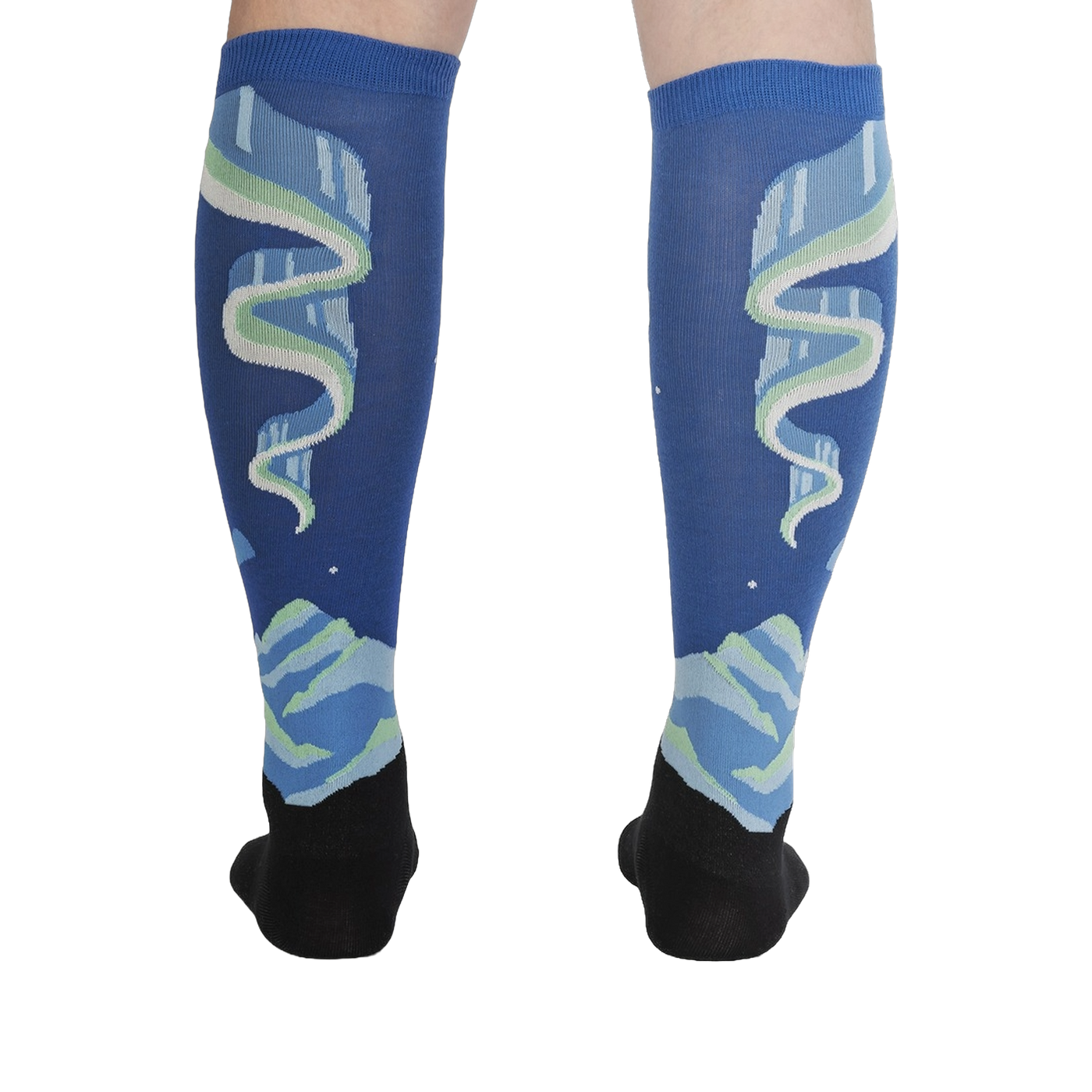 Rear view of the socks on a model's legs, highlighting the symmetrical design and glow-in-the-dark feature.