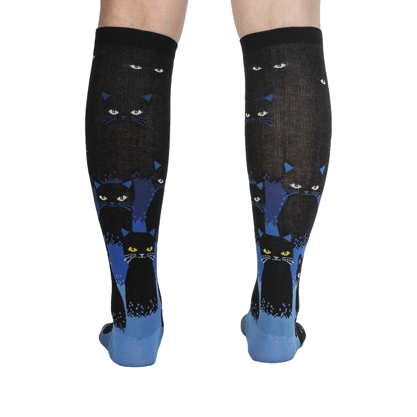 Rear view of the socks on a person's legs, showcasing the full design and cat pattern.
