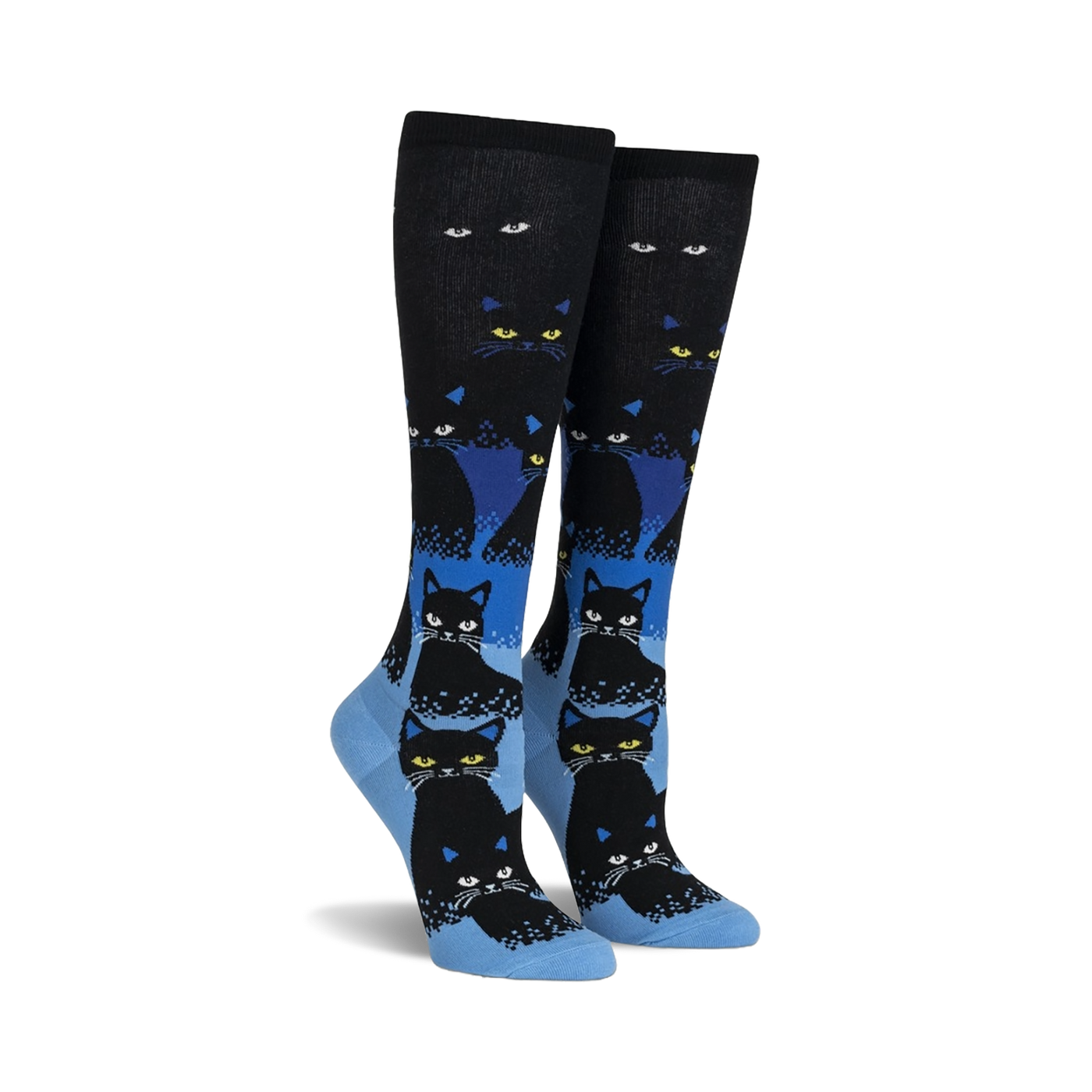 Pair of black and blue knee-high socks with a repeating pattern of black cats. The cats glow in the dark, and the socks have a gradient design.