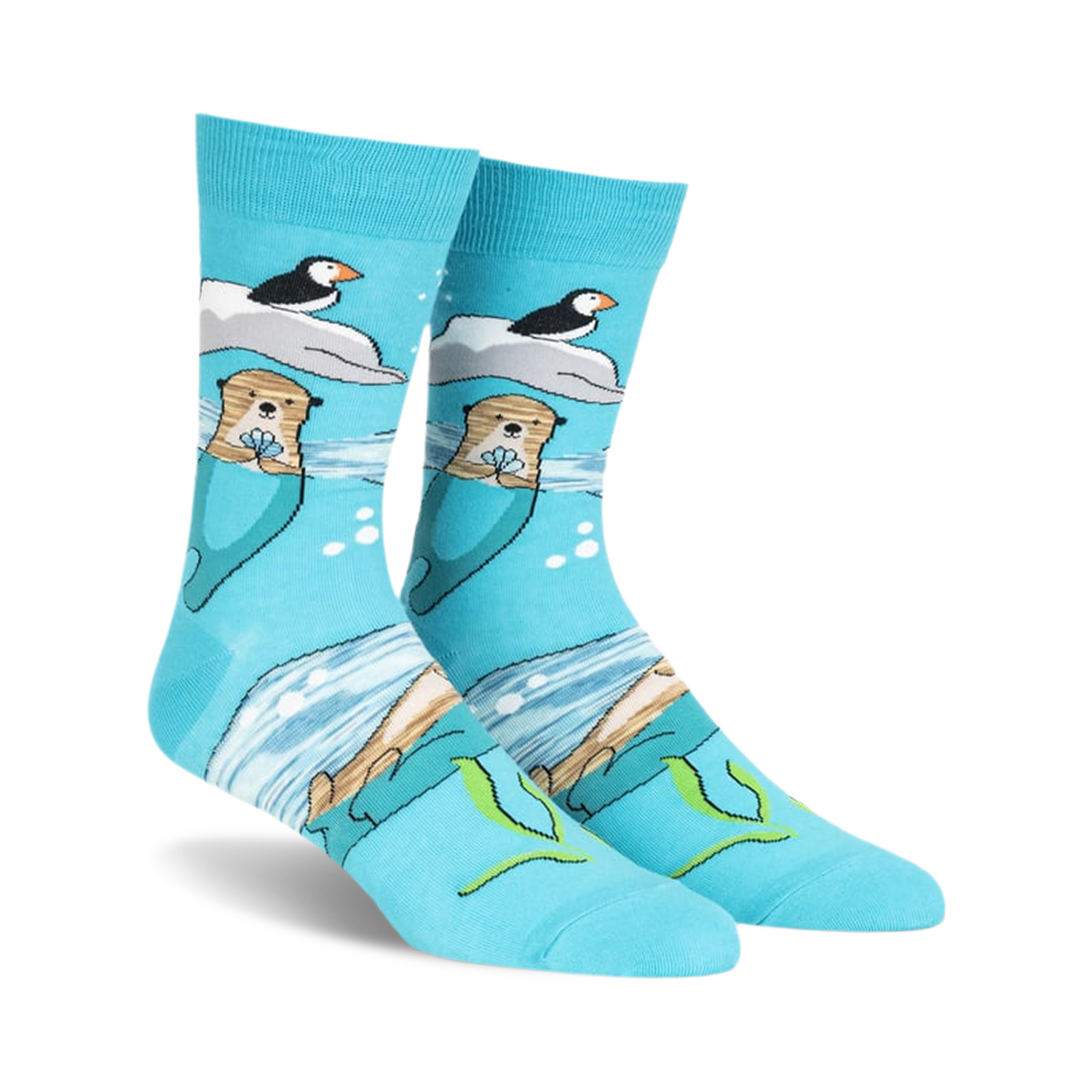 Crew socks in teal featuring otters holding flowers, puffins on ice floes, and an ocean scene. Made with space dye yarn.