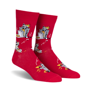 pair of red socks with raccoons eating pizza. the socks have a black and white illustration of a raccoon eating pizza from a box, with a design that repeats across the entire sock. the socks are lying flat on a white background.  a full side view of the socks.