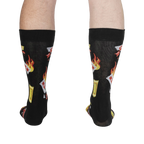 Rear view of the 'Extra Hot' socks on a person's legs. The back of the socks shows the full design.