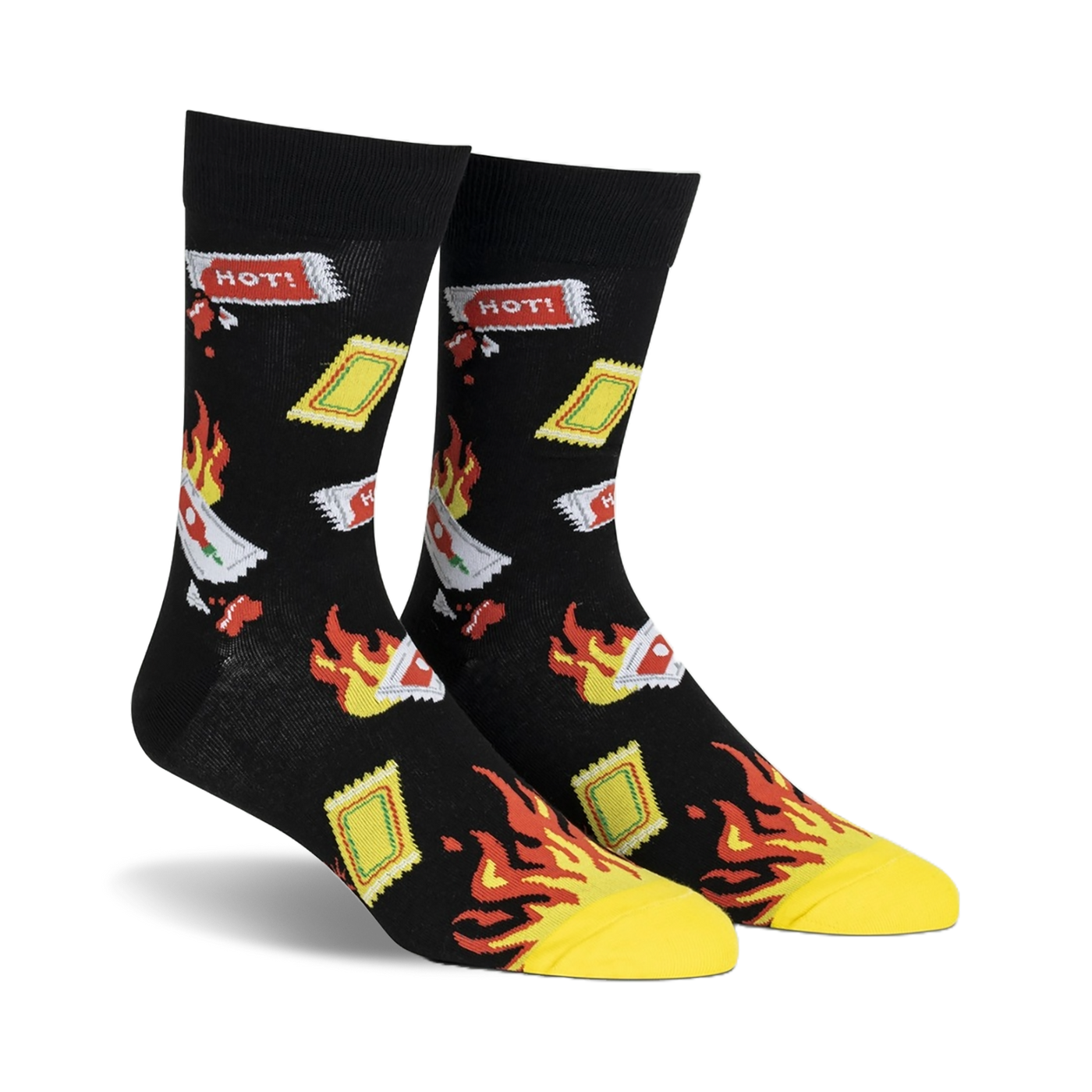 Pair of black crew socks with a playful design of flaming hot sauce packets and yellow flames.  'HOT!' text is visible on some packets.