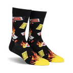 Pair of black crew socks with a playful design of flaming hot sauce packets and yellow flames.  'HOT!' text is visible on some packets.
