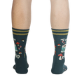 Rear view of a person wearing the teal 'Take a Trip' socks, displaying the back design