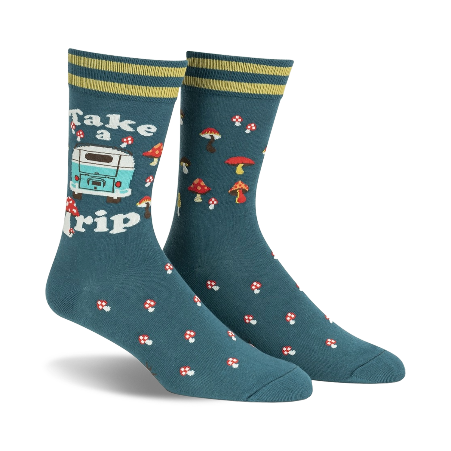 Pair of teal crew socks with a retro camper van, mushrooms, and the text 'Take a Trip'. Yellow and green stripes at the cuff.