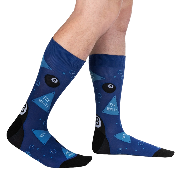 A pair of blue socks with a black heel and toe. The socks have a pattern of eight balls and triangles.