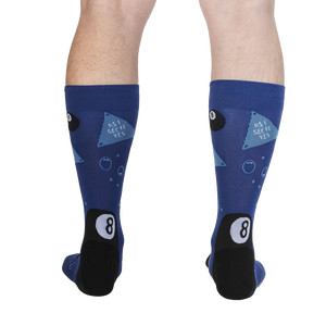 A pair of blue socks with a black heel and toe. The socks have a pattern of eight balls and triangles.
