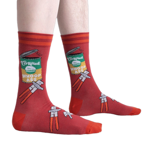 Lifestyle shot of a person wearing the 'Opening Up A Can' socks, showcasing the design on the leg.