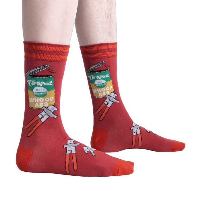 Lifestyle shot of a person wearing the 'Opening Up A Can' socks, showcasing the design on the leg.
