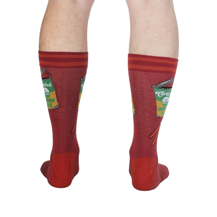 Rear view of a person's legs wearing the 'Opening Up A Can' socks, emphasizing the design's full appearance.