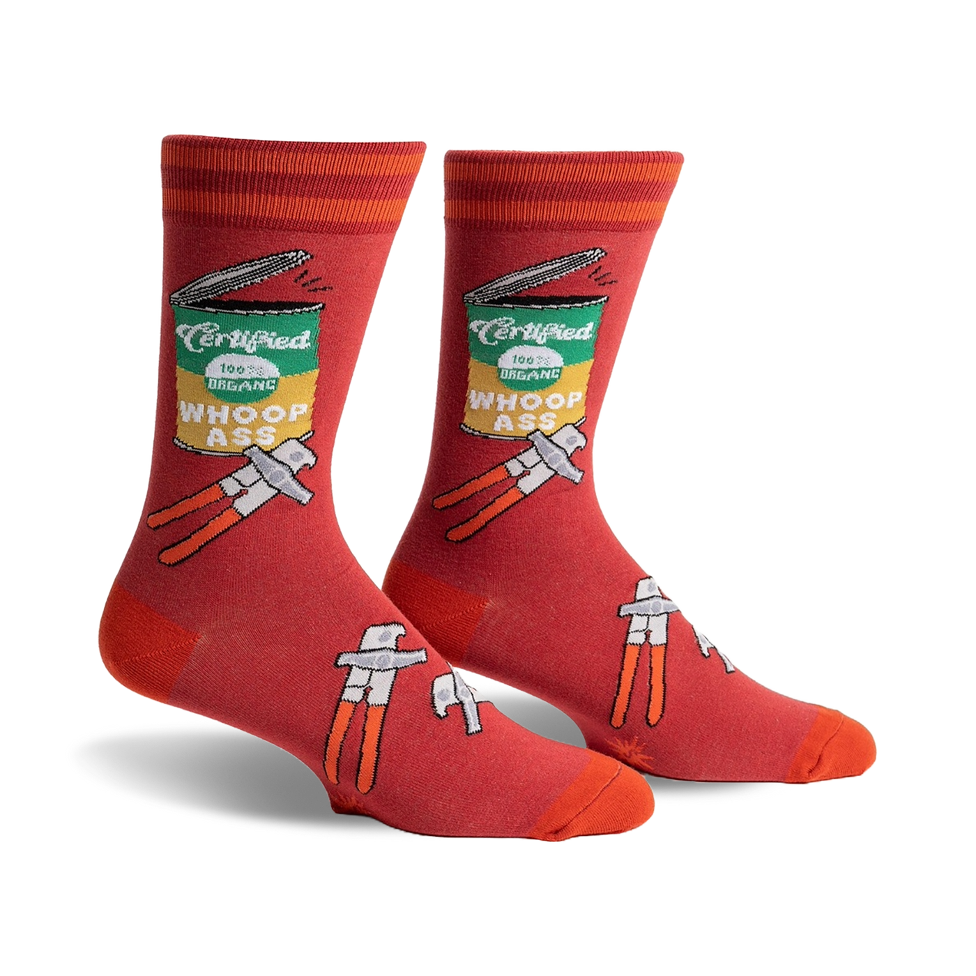 Pair of men's crew socks in red with an illustrated can of 'Whoop Ass' and tools.  Features orange stripes at the top.