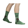 Lifestyle shot of a person wearing the green goat socks.
