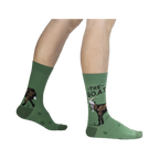 Lifestyle shot of a person wearing the green goat socks.