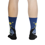 Rear view of a person wearing The Starry Flight socks, showcasing the sock's design from the back.