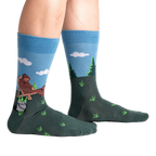 Lifestyle shot of 'Bucket List' socks on a person's legs, showing the socks' fit and design.