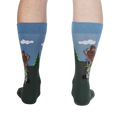 Rear view of a person wearing the 'Bucket List' socks, showcasing the design on the back of the socks.