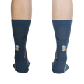 Rear view of Brew-Dolph socks on a person's legs, highlighting the full design on the back.