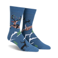 Crew socks in navy blue featuring reindeer with beer and Christmas lights, snowy landscape design.