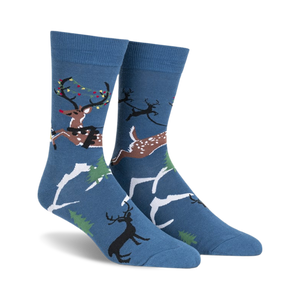 front view of a pair of blue socks with a christmas reindeer pattern.