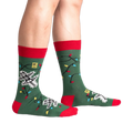 Lifestyle shot of model wearing the 'Eating Light' glow-in-the-dark socks.