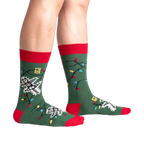 Lifestyle shot of model wearing the 'Eating Light' glow-in-the-dark socks.