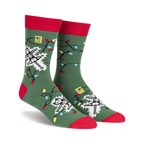 Crew socks in green with red cuffs, featuring a skeleton tangled in colorful Christmas lights.  The design glows in the dark!