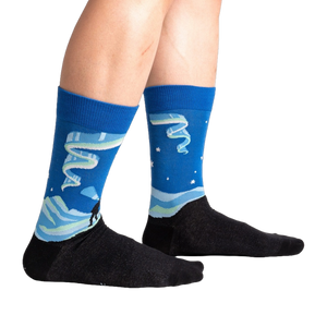 Lifestyle shot of a person wearing the Northern Lights socks, showcasing the design and fit.