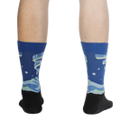 Rear view of a pair of Northern Lights socks on a person's legs, highlighting the full design and color scheme.